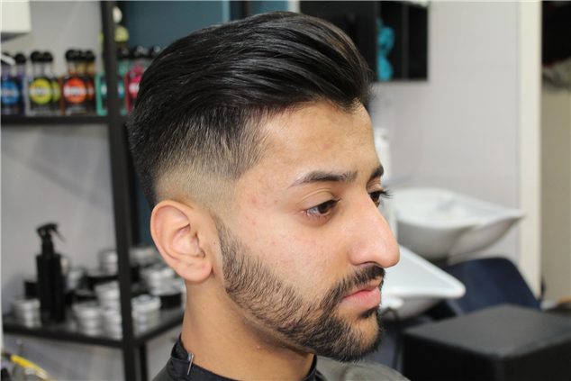 Low zero with two tone fade and  beard shape up. 