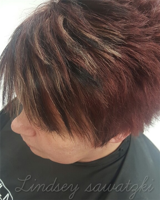 Blonde highlights and black lowlights on red short hair
